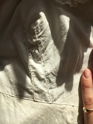 Lot 101 - A white percale morning coat, English, circa 1814