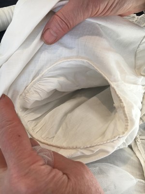 Lot 101 - A white percale morning coat, English, circa 1814