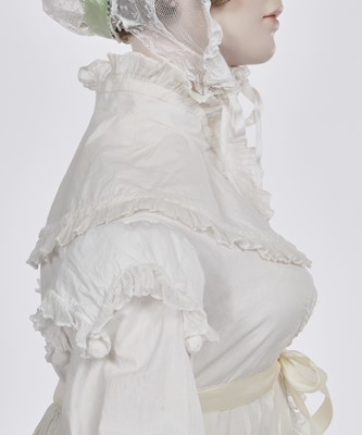 Lot 101 - A white percale morning coat, English, circa 1814
