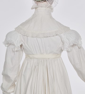 Lot 101 - A white percale morning coat, English, circa 1814