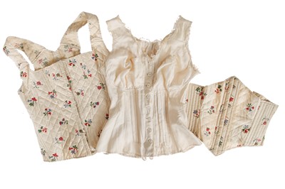 Lot 657 - A pair of quilted embroidered chintz jumps and matching waist cincher, late 19th century