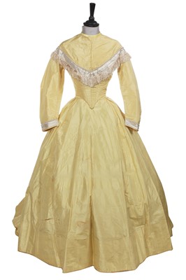 Lot 495 - A primrose-yellow taffeta evening gown, 1860-64