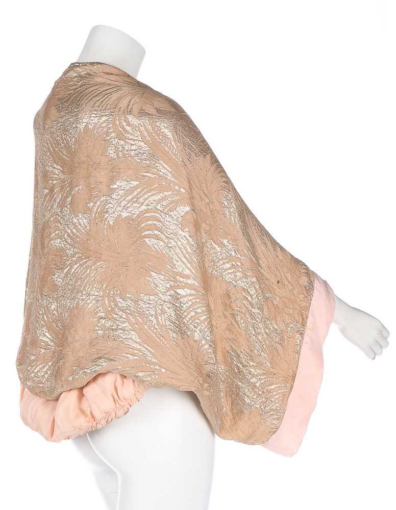 Lot 2 - A pink lamé evening jacket, early 1930s, with...