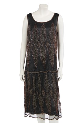 Lot 628 - A beaded black silk and tulle flapper dress, circa 1924
