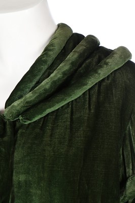 Lot 30 - A green velvet evening coat, early 1930s, with...