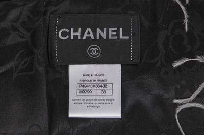 Lot 17 - A Chanel by Karl Lagerfeld black and white fantasy tweed and ostrich feather cloak, 'Paris-Dallas' collection, Métiers d'Art, Pre-Fall 2014