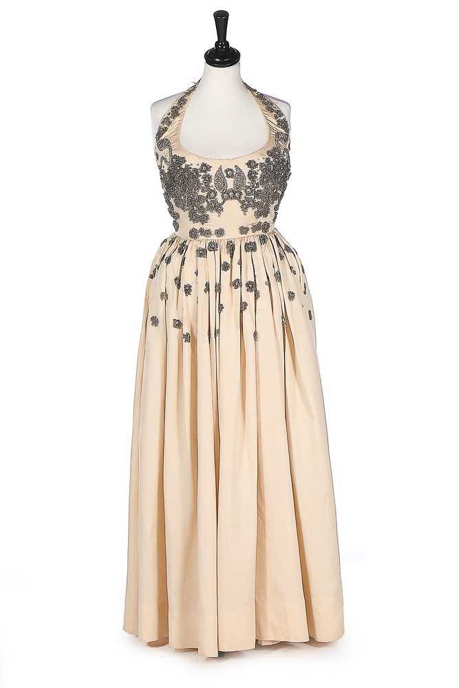 Lot 74 - A Molyneux couture ivory silk grosgrain...