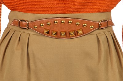 Lot 179 - An Hermès green-beige wool skirt, late 1980s-90s