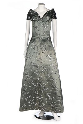 Lot 24 - A Jean Patou chinoiserie brocaded satin gown,...