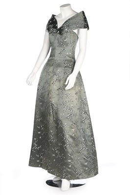 Lot 24 - A Jean Patou chinoiserie brocaded satin gown,...