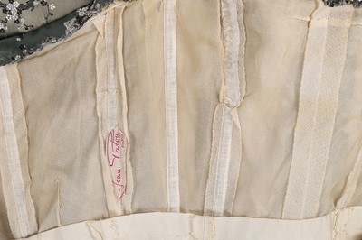 Lot 24 - A Jean Patou chinoiserie brocaded satin gown,...