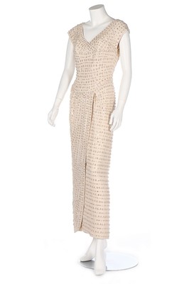 Lot 32 - A Norman Hartnell couture beaded silk crêpe...