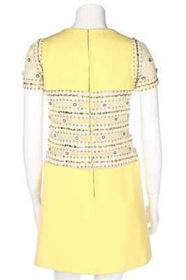 Lot 69 - A Torrente couture yellow worsted mini-dress,...