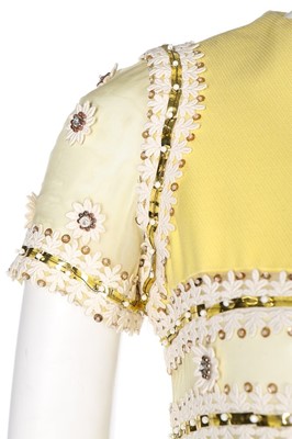 Lot 69 - A Torrente couture yellow worsted mini-dress,...