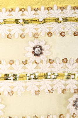 Lot 69 - A Torrente couture yellow worsted mini-dress,...