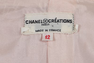 Lot 242 - A Chanel by Philippe Guibourge pink slubbed silk suit, 1970s