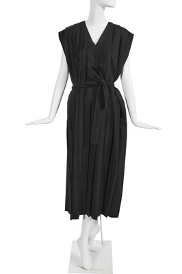 Lot 152 - An early Comme des Garçons pleated black wool dress, 'Dots, Polyester Pleats' collection, Autumn-Winter 1985-86