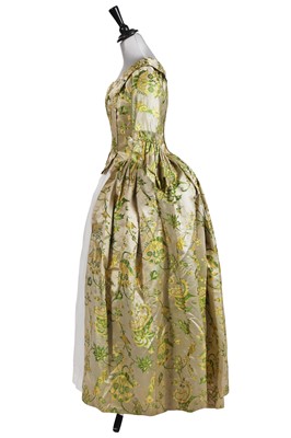 Lot 533 - A fitted gown, of bizarre brocaded satin circa 1708, the construction 1740-50