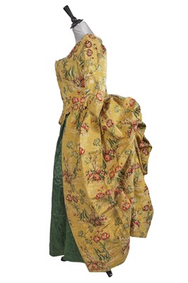 Lot 525 - A robe à l'Anglaise of 1730s figurative brocaded silk, the construction 1770s