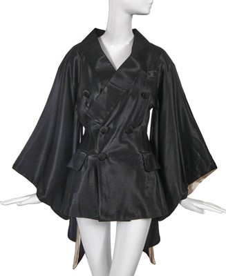 Lot 190 - A John Galliano black satin Minimono, 'Black' collection, Autumn-Winter 1994-95