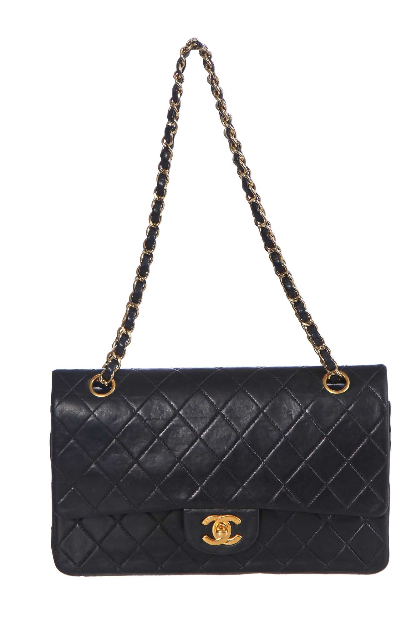 Lot 28 - A Chanel quilted navy blue lambskin leather Classic double flap bag, 2000-2002