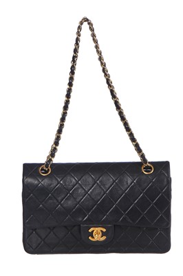 Lot 28 - A Chanel quilted navy blue lambskin leather Classic double flap bag, 2000-2002