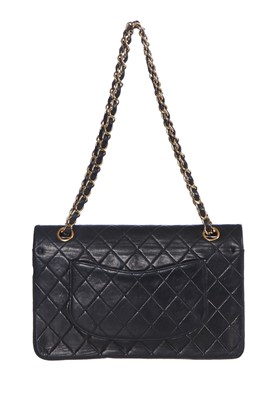 Lot 28 - A Chanel quilted navy blue lambskin leather Classic double flap bag, 2000-2002