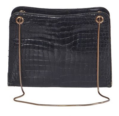 Lot 45 - A Cartier black crocodile handbag, 1959