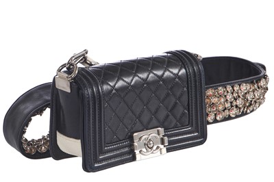 Lot 24 - A Chanel by Karl Lagerfeld black leather Boy bag with embellished strap, 'Paris-Bombay' collection, Métiers d'Art, Pre-Fall 2012