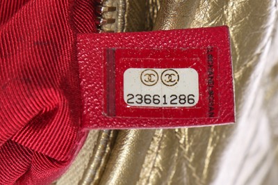 Lot 10 - A Chanel by Karl Lagerfeld small gold leather Gabrielle hobo bag, circa 2017