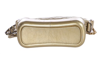 Lot 10 - A Chanel by Karl Lagerfeld small gold leather Gabrielle hobo bag, circa 2017