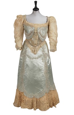 Lot 484 - A Charles Frederick Worth eau de nil satin evening gown, 1893-4