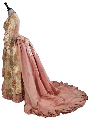 Lot 491 - A Lizzie McColl brocaded satin and pink silk evening gown, 1880-85