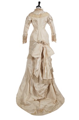 Lot 832 - An ivory silk faille bridal gown, circa 1880
