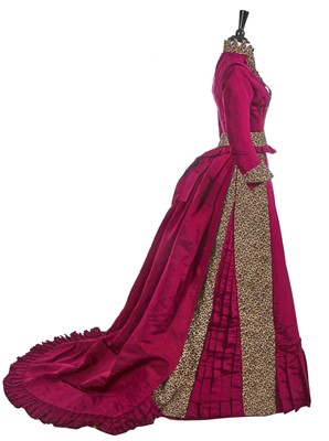 Lot 828 - A deep pink faille and velvet reception gown, circa 1889