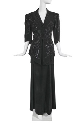 Lot 444 - A Jean Patou embellished black crêpe suit, Autumn-Winter 1945-46