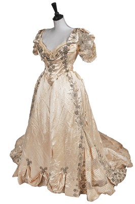 Lot 483 - A Charles Frederick Worth embroidered ivory satin ball gown, circa 1894