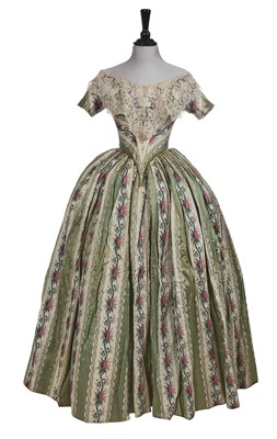 Lot 498 - A fine green striped and floral brocaded gown with day and evening bodices, circa 1854