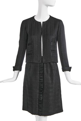 Lot 37 - A Gabrielle Chanel haute couture black herringbone silk suit, circa 1965