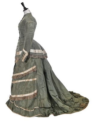 Lot 732 - A contrasting aquamarine silk and grey satin reception gown, circa 1875