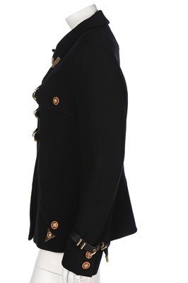 Lot 79 - A Gianni Versace bondage-style black wool...