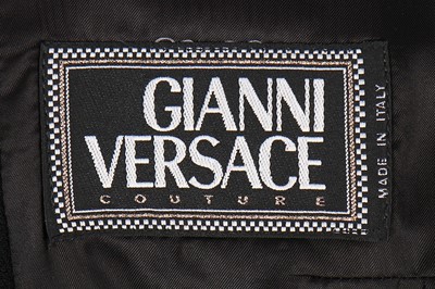 Lot 79 - A Gianni Versace bondage-style black wool...