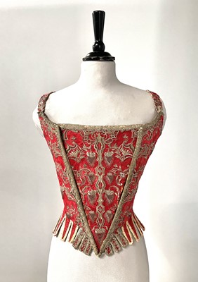 Lot 537 - A pair of scarlet damask smooth covered stays, the embroidery and construction circa 1710