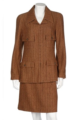 Lot 104 - A Chanel herringbone tweed suit, Autumn-Winter...