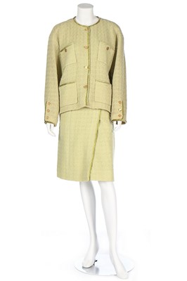 Lot 173 - A Chanel pale green tweed suit, probably 1990s,...