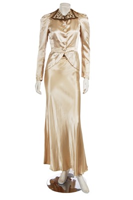 Lot 671 - A gold satin evening ensemble, circa 1935