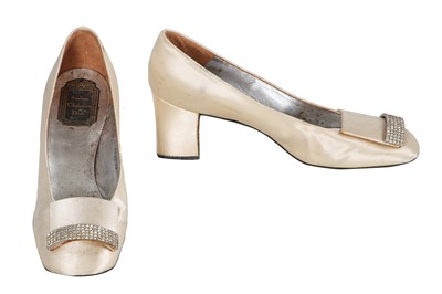 Lot 613 - A pair of Christian Dior cream satin pumps, circa 1965