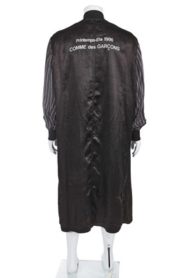 Lot 121 - A Comme des Garçons black satin staff coat, Spring-Summer 1986