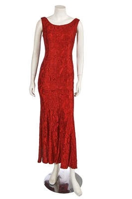 Lot 557 - A Dolce & Gabbana red lace gown, 1990s