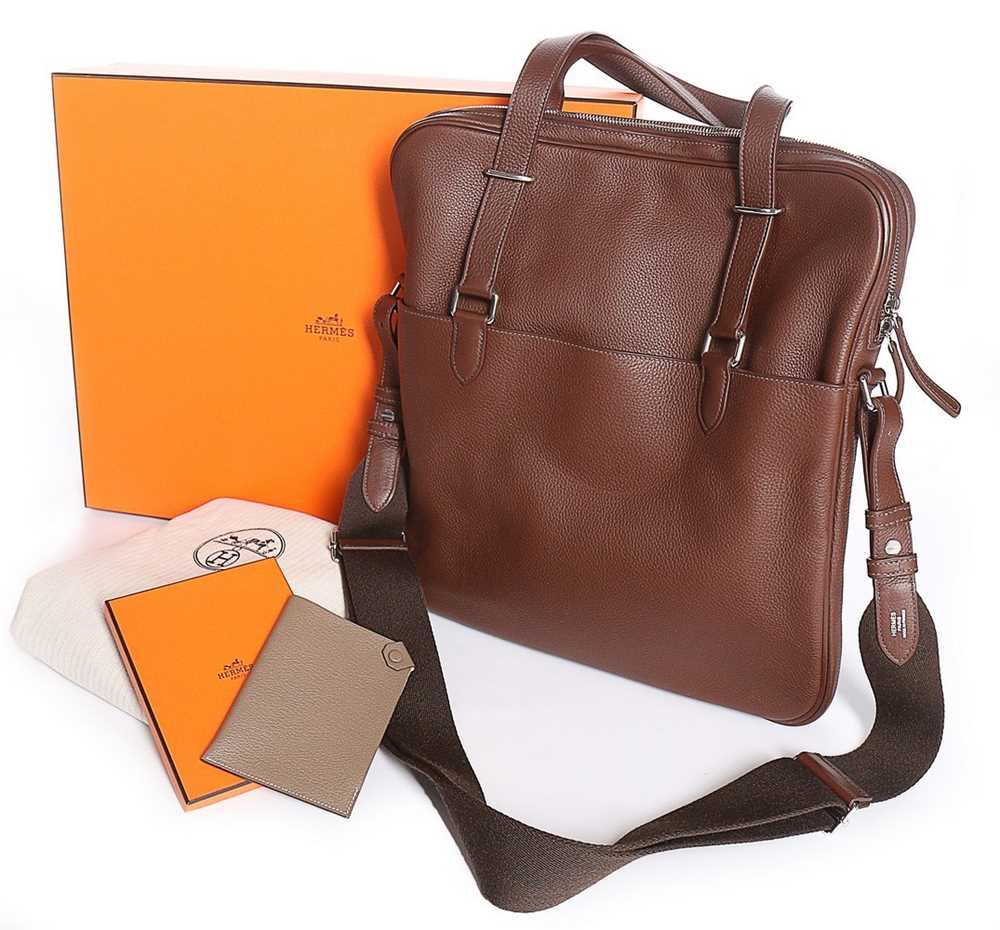 Lot 96 - An Hermès ebony calfskin men's 'Hebdo'...